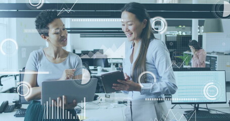 Image of financial data processing over diverse colleagues discussing work in office