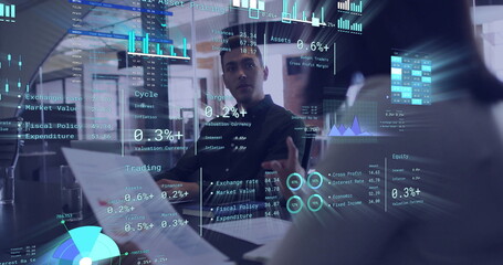 Image of diagrams and data processing over diverse colleagues discussing work in office