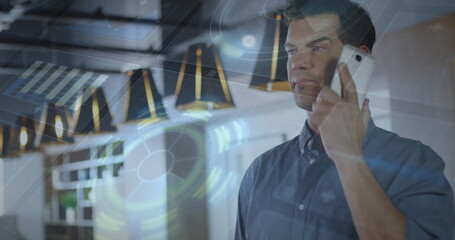 Image of data processing and scope scanning over caucasian man talking on smartphone