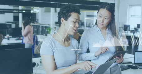 Image of financial data processing over diverse colleagues discussing work in office