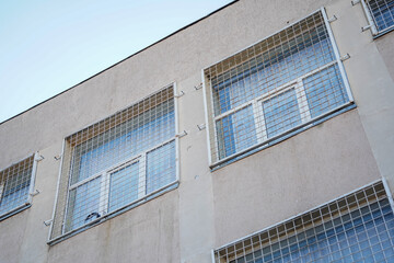 the barred windows of a maximum security penitentiary. detail.