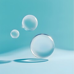 Three Opaque Beads of Varying Sizes Against a Soft Blue Background