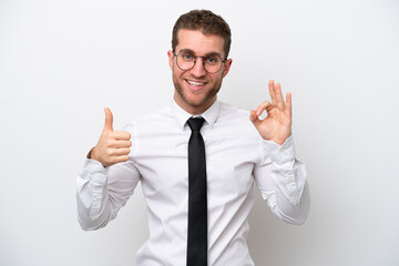 Young business caucasian man isolated on white background showing ok sign and thumb up gesture