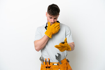 Young caucasian electrician man isolated on white background thinking and sending a message