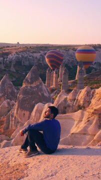 tourist watching the ballons in capadocia turkey