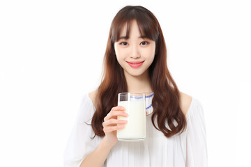 Teen pretty Japanese girl over isolated white background having breakfast milk