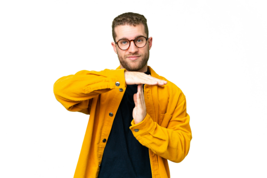 Young handsome blonde man over isolated chroma key background making time out gesture