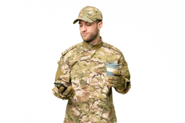 Military man over isolated chroma key background holding coffee to take away and a mobile