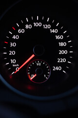 speedometer on black background