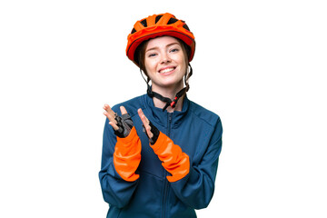 Young cyclist woman over isolated chroma key background applauding after presentation in a conference