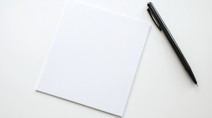 Blank Sheet of Paper and Pen on a White Background