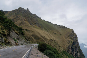 Winding mountain road is leading to the abra malaga pass in peru, a high-altitude mountain pass located in the andes mountains