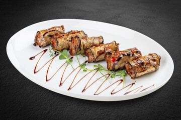 A savory meat roll stuffed with roasted eggplant, creating a flavorful blend of textures and tastes.