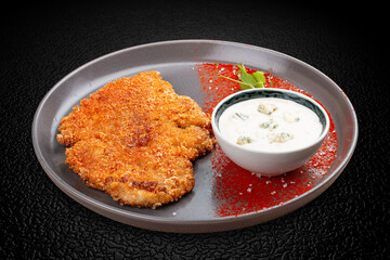 Chicken schnitzel with blue cheese sauce and paprika