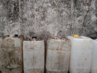 arrangement of used vegetable oil jerry cans