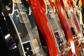 musical instrument shop with electric guitars for sale or rent for concerts