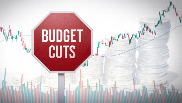 Budget cuts sign with financial graphs and stacked coins, representing reduction in government spending and economic measures, finance austerity concept, economic pressure, financial limitation
