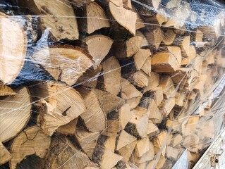 A pile of wood wrapped in plastic wrap