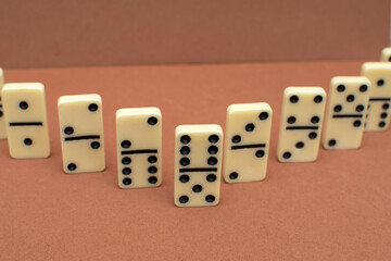 Dominoes bones on brown background	