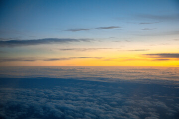 China Shanghai - Sunrise above the clouds from the plane
