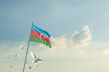 Azerbaijan flag waving with flying doves in beautiful sky. Azerbaijan flag for Republic Day and Independence Day.