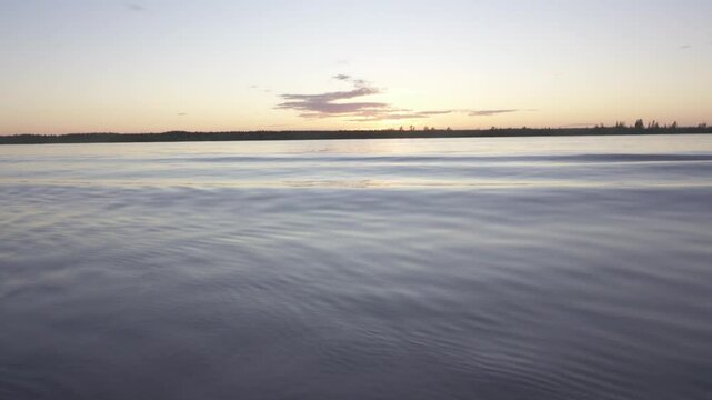 Potamology. The navigable Svir River in northwestern Russia at its confluence with Lake Ladoga. Part of White Sea - Baltic Canal. Springtime. The ice is gone, channel fairway, calm water surface