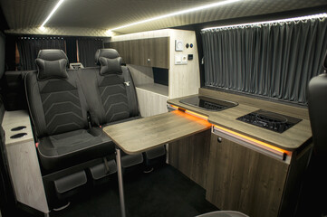 Comfortable interior of a passenger bus with soft seats. The design is made to order. Private...