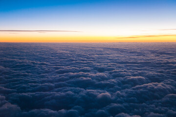 China Shanghai - Sunrise above the clouds from the plane
