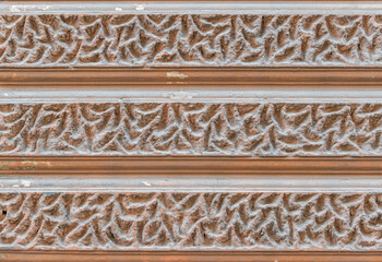 Intricate Textured Wall Design Featuring Ornate Patterns Detailing Surface Depths Colors