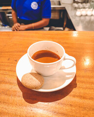 Espresso coffee shot with a biscuit at a cafe in Bhubaneswar, Odisha, India in August 2023....