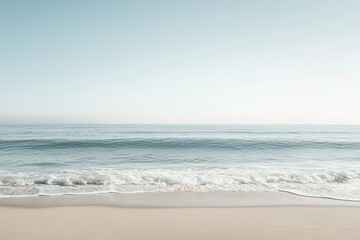 Fototapeta premium Tranquil beach scene with gentle waves and clear sky