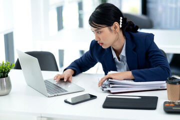 Young businesswoman with her hands on her head  looking seriously