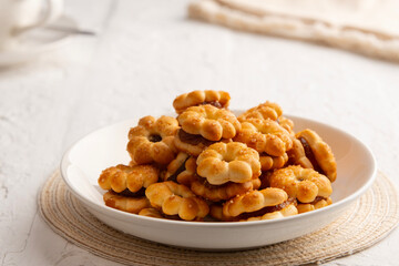 Pineapple Cracker Cookie Biscuits,crunchy crackers in daisy shape filled in between with pineapple jam.Thai traditional sandwich cookie.