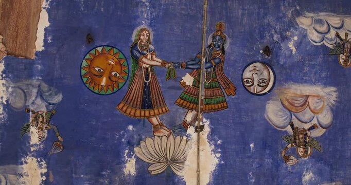 Close-up View on Frescoes Decoration On Wall Of Hanuman Temple In Jaipur, India. Sita And Rama with Sun and Moon. Life Story Of Rama, Sita And Their Companions Allegorically Discusses Duties, Rights