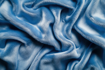 Luxurious soft blue faux fur texture background, featuring smooth and wavy patterns perfect for elegant and cozy design applications.