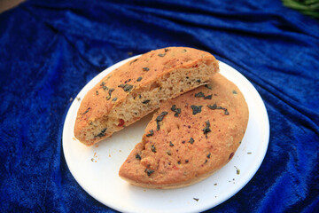 Handmade bread with herbs on a plate