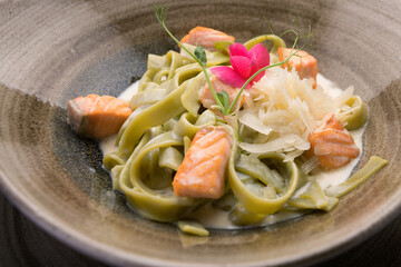 Fettuccine Verde with salmon, Parmesan cheese and sauce