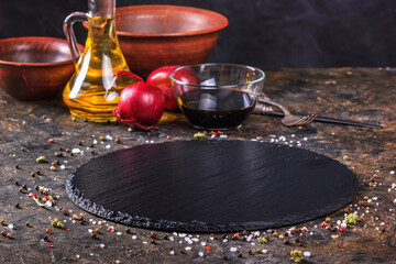 Culinary background with soy sauce and olive oil, kitchen slate stone serving platter. Selective...