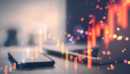 Digital forex trading graph overlay with mobile phone and laptop on desk background.