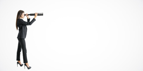 Businesswoman in suit looking through a telescope, positioned on the left side. Light background. Concept of future vision and opportunities © Who is Danny