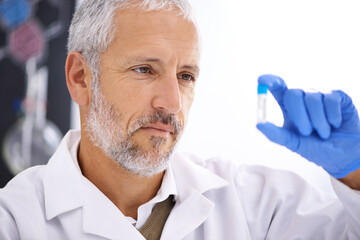 Science, man and vial in lab for experiment, chemical development and gloves for safety. Mature scientist, thinking and liquid in tube for observation, results or medicine engineering or innovation