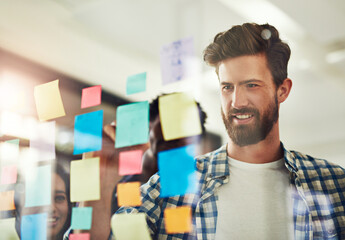 Business man, glass and sticky note for brainstorming, planning and collaboration objectives with...