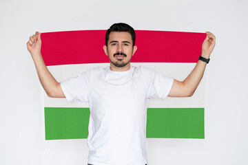 Moustached man holding Tajikistan flag, campaigning concept, patriot and nationalist person
