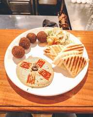 Falafel, hummus and pita bread at a cafe in Bhubaneswar, Odisha, India in August 2023....