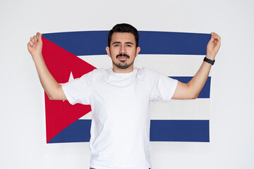 Moustached man holding Cuba flag, patriot and nationalist person, independence or celebration day 