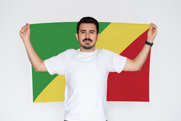 Moustached man holding Republic Of The Congo flag, patriot and nationalist person, campaigning 