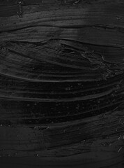 Texture of black acrylic paint. Image is ideal for creative projects, background designs or illustrations where cleanliness and sophistication are required.