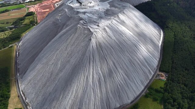 White Spoil Tip in Germany - Aerial view of a mining waste disposal that causes ecological damage. A Huge Pile of Rock.