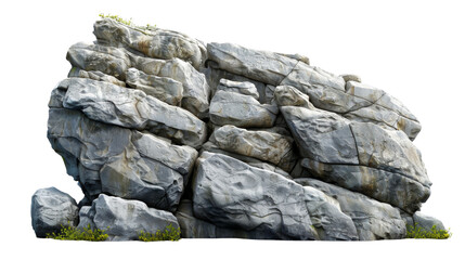 A large, textured rock formation with some greenery at the base.