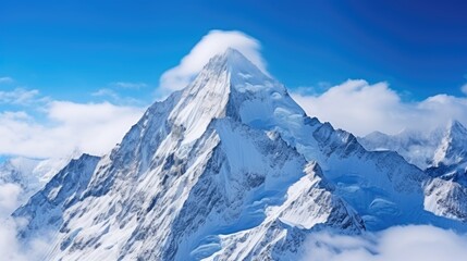 Obraz premium A majestic snow-capped mountain peak pierces through a veil of clouds, creating a breathtaking panorama of icy beauty and serene tranquility.